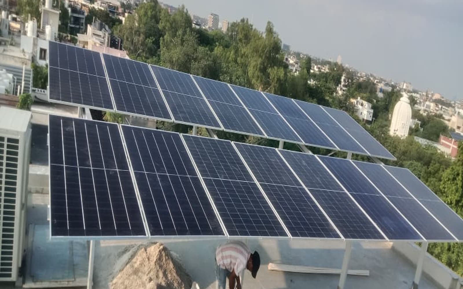 The elevated structure keeps the solar system visually integrated with the home while leaving the rooftop below organized and accessible.