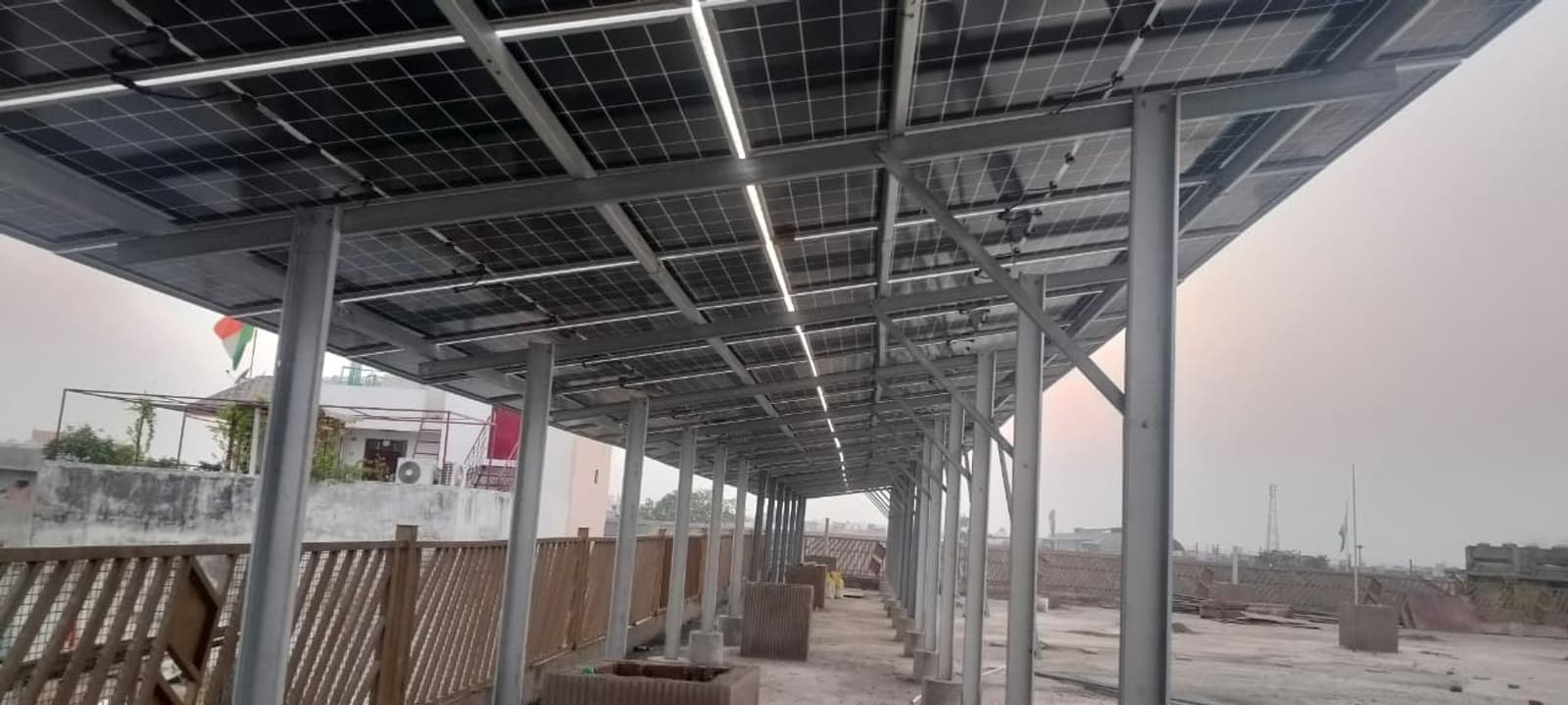 The 8-12 ft high structure keeps the panels above the working rooftop level and supports future-oriented rooftop utilization.