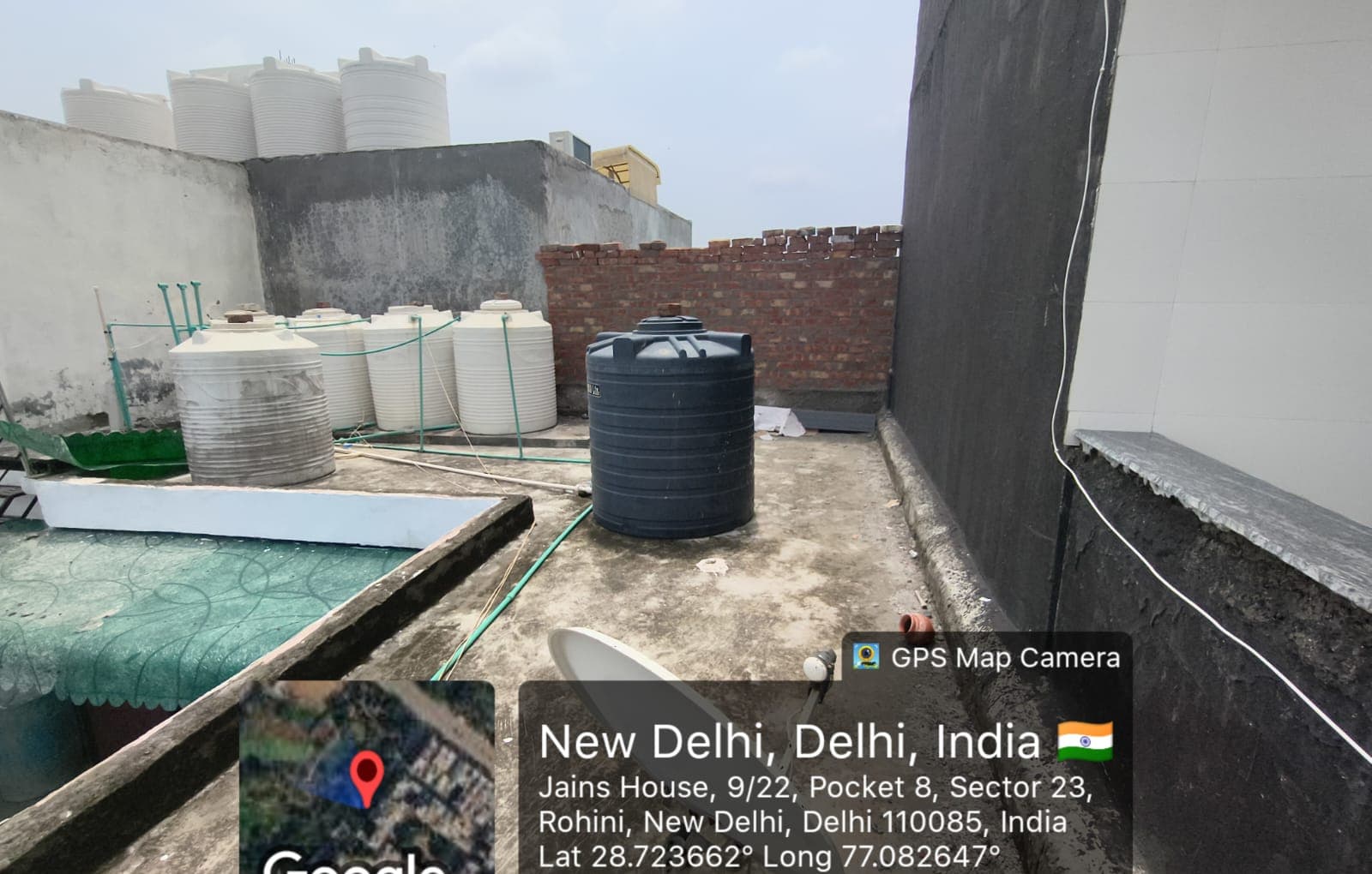Before installation, the roof had water tanks, service areas and shade risk from surrounding high-rise construction.